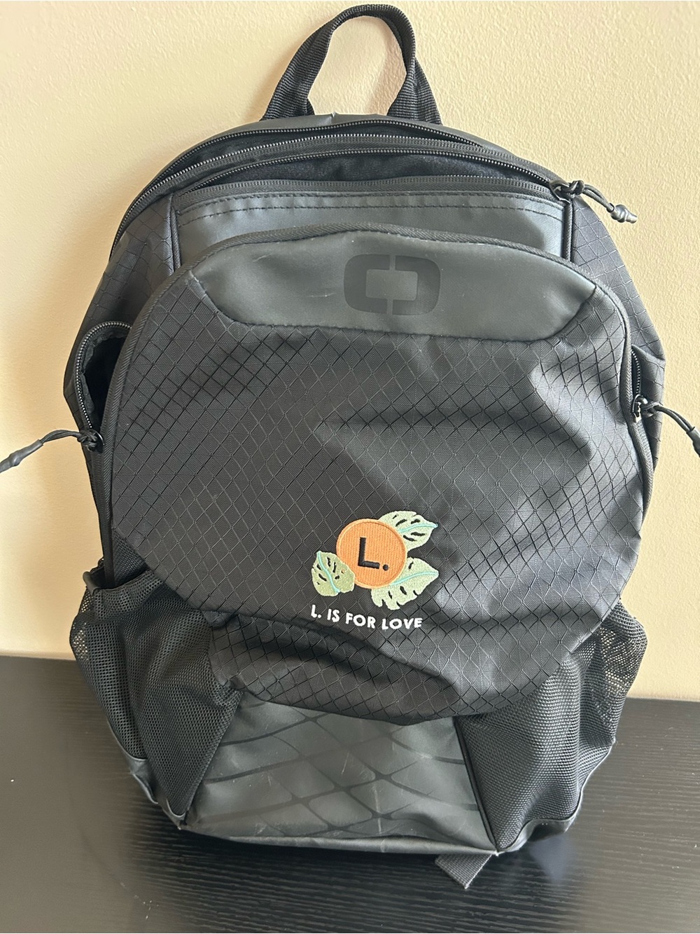 OGIO Black Backpack with Orange 'L. Is For Love' Patch